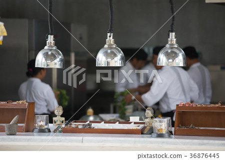 Blurry background of chef in restaurant kitchen  36876445