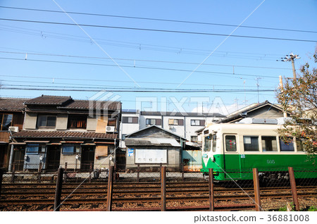 Hankan train running in a residential area 36881008
