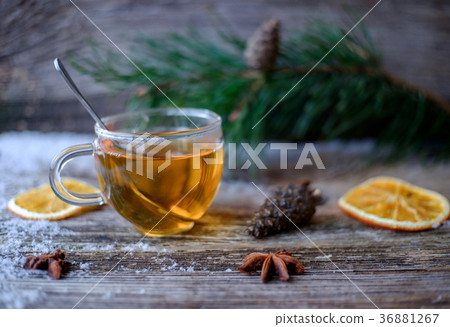 tea glass Cup on a wooden table with pine branches 36881267