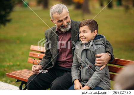 Grandpa and his grandson spend time together in 36882780