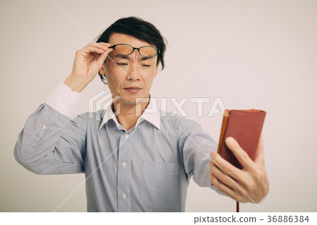 Middle man presbyopia that smartphone is hard to see 36886384