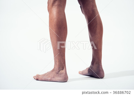 Muscular male legs Stock Photo