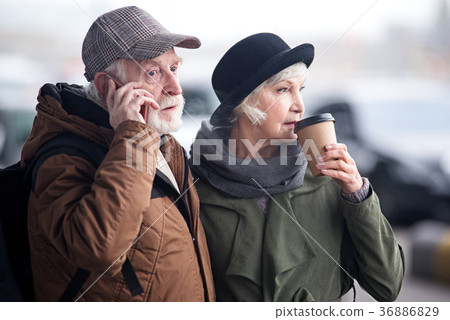 Pensive aged couple is resting outdoors Pensive aged couple is resting outdoors 36886829