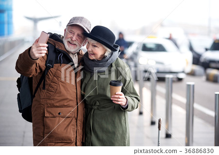 Pleasant senior couple are making picture using Pleasant senior couple are making picture using 36886830