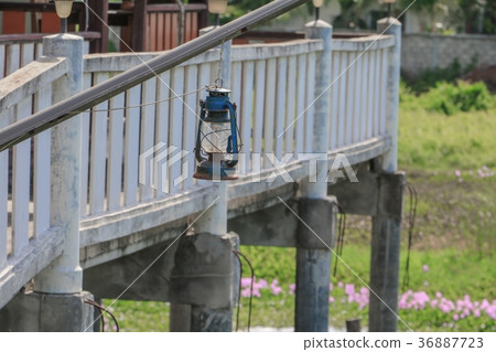 Old blue rusty lantern in the garden Old blue rusty lantern in the garden 36887723