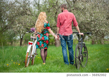 Loving young couple with bicycles 36892002