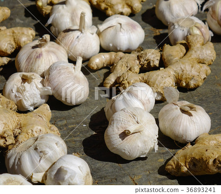 Garlic and ginger on the floor 36893241