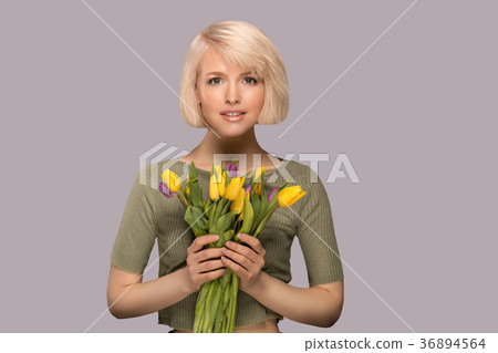 Woman holding a bouquet of tulips Woman holding a bouquet of tulips 36894564