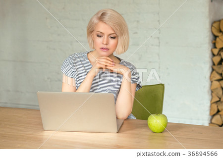 Girl with laptop at home 36894566