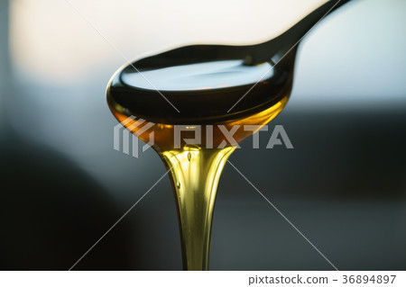 organic honey dripping from spoon organic honey dripping from spoon 36894897