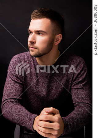 Handsome serious man isolated on a blac Handsome serious man isolated on a blac 36896008