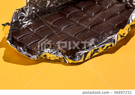 Bitten Chocolate bar in foil isolated  36897252
