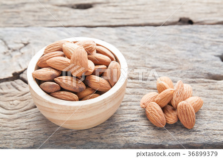 group of almonds from wood bowl group of almonds from wood bowl 36899379