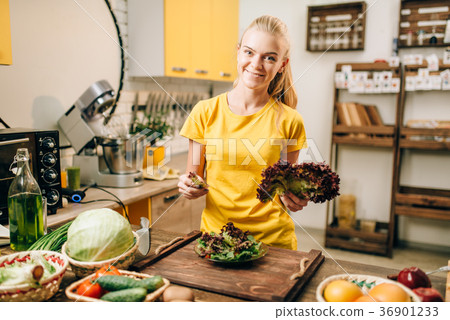 Happy woman holding salad, cooking healthy food 36901233