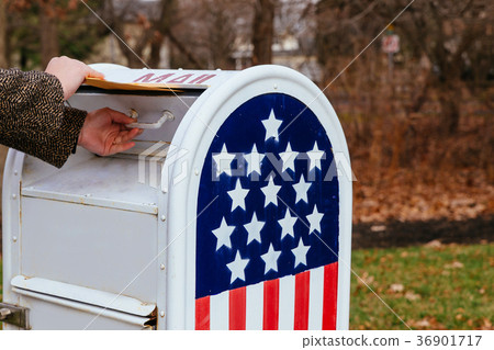 Close-up Of Person's Hand Putting Letters Mailbox Close-up Of Person's Hand Putting Letters Mailbox 36901717