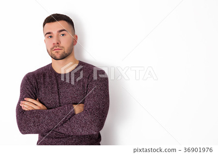 Handsome man standing with crossed arms isolate Handsome man standing with crossed arms isolate 36901976