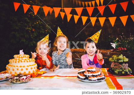 Children's birthday party. Three cheerful children 36902970