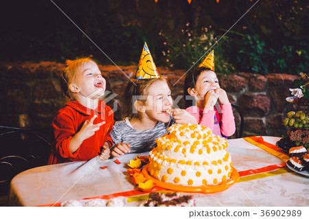 Children's birthday party. Three cheerful children 36902989