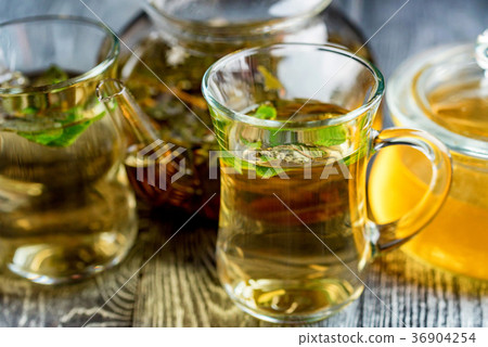 Herbal tea with honey and mint leaves 36904254