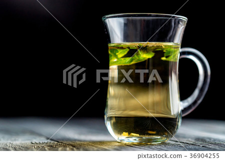 Herbal tea with honey and mint leaves Herbal tea with honey and mint leaves 36904255