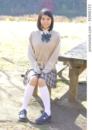 High school student high socks sitting on a bench 36906153