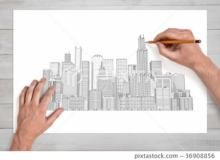 Male hands drawing a city crape with many 36908856