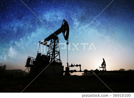 Oil pump on the oil field in the night Oil pump on the oil field in the night 36910100