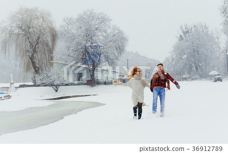 Full-length view of the cheerful laughing couple Full-length view of the cheerful laughing couple 36912789