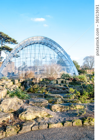 Arched glass house and stone steps in Kew Gardens, England Arched glass house and stone steps in Kew Gardens, England 36913691
