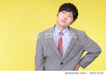 A tired businessman A tired businessman 36913726