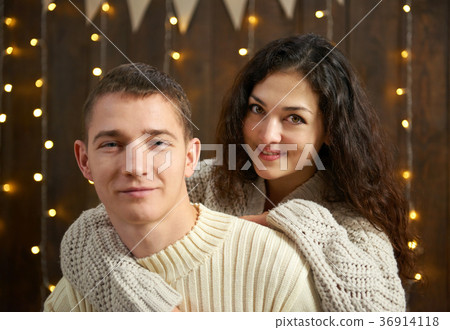 young couple together in christmas lights 36914118