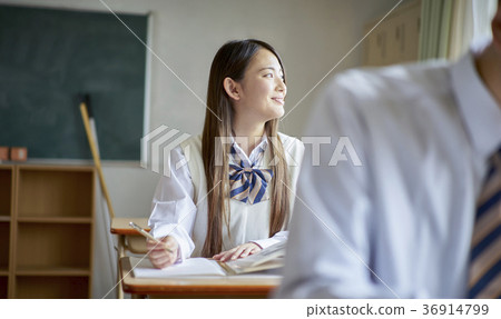 Students studying in a classroom 36914799