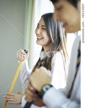Students cleaning the classroom 36914805
