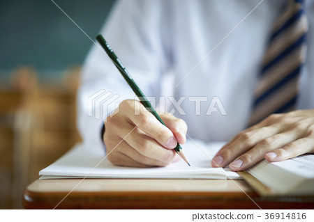 Students studying in a classroom 36914816