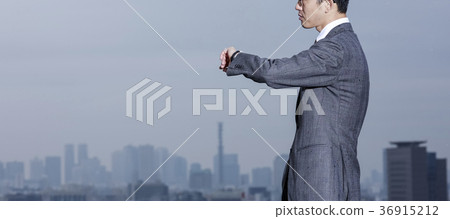 Businessman standing on the roof 36915212