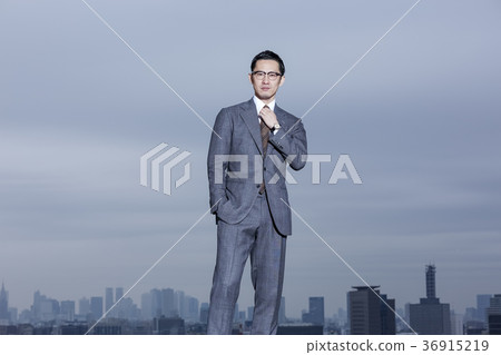 Businessman standing on the roof Businessman standing on the roof 36915219