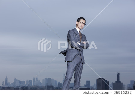 Businessman standing on the roof Businessman standing on the roof 36915222