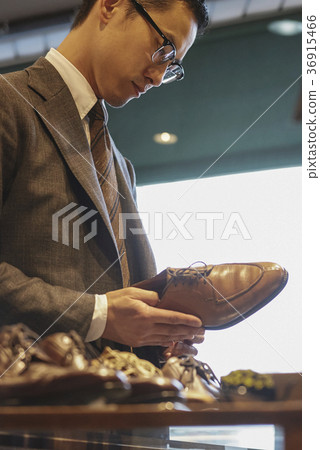 Men in men's clothing store 36915466