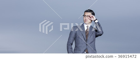 Businessman standing on the roof Businessman standing on the roof 36915472