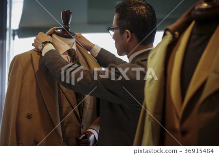 Men in men's clothing store 36915484