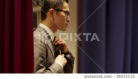 Men in men's clothing store 36915518