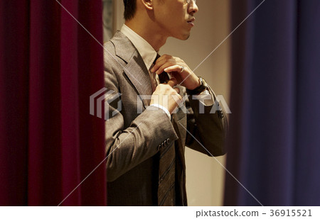 Men in men's clothing store 36915521