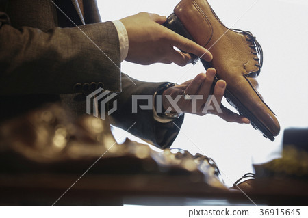Men in men's clothing store Men in men's clothing store 36915645
