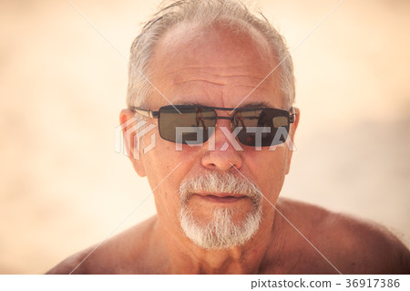 Portrait of Grey Bearded Old Man in Sunglasses Portrait of Grey Bearded Old Man in Sunglasses 36917386