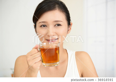 A woman relaxing tea A woman relaxing tea 36918591