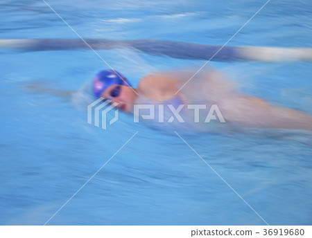 Swimmer in cap breathing  bokeh effect 36919680