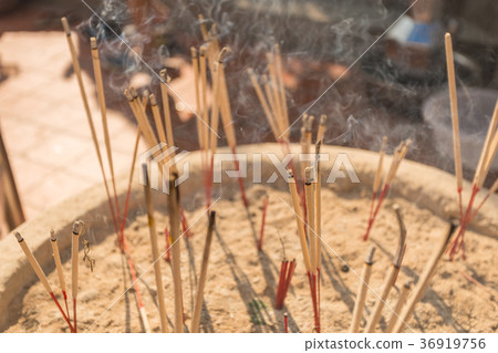 Incense sticks burning with white smoke 36919756
