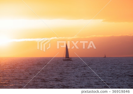 Beautiful sunset at the sea with sailing boat 36919846