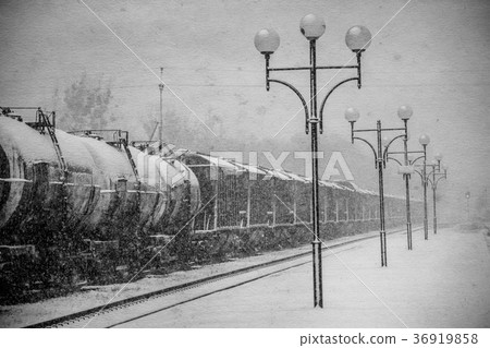 Blizzard on railway, freight train in snow 36919858