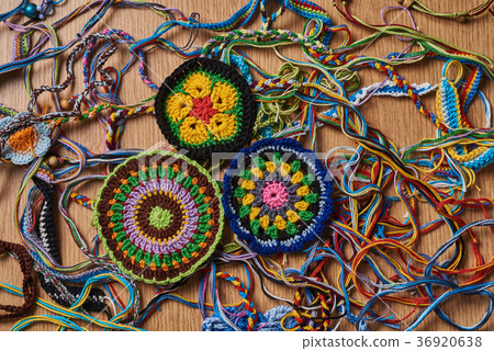 Three knitted drink coasters. 36920638